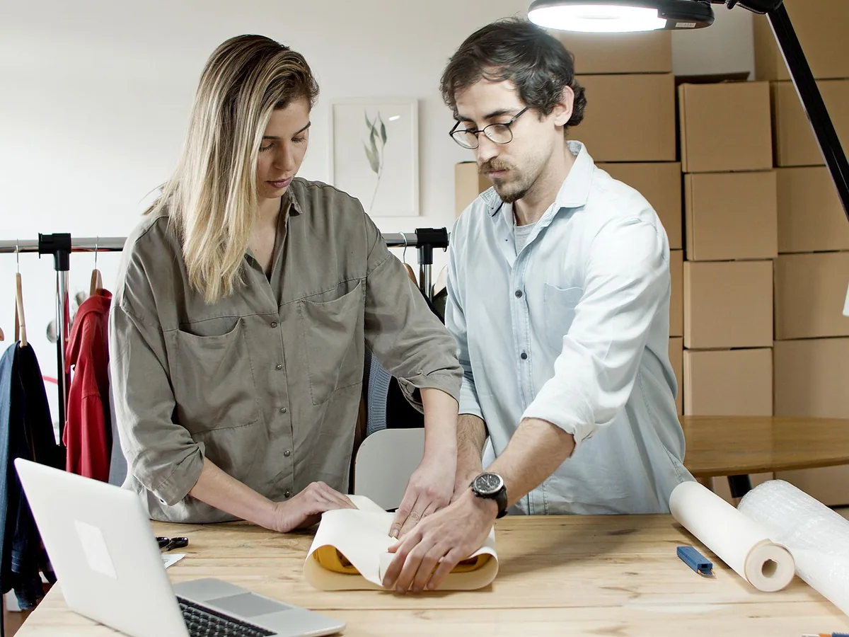 Illustrative stock photograph by Kampus Production / Pexels Business partners packing products for online orders
